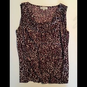 Women’s sleeveless cami top with scoop neck.